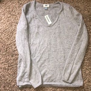 grey V-neck sweater